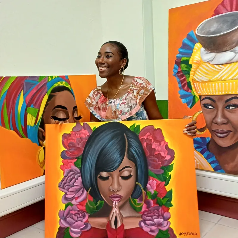 Æmy with three finished canvases